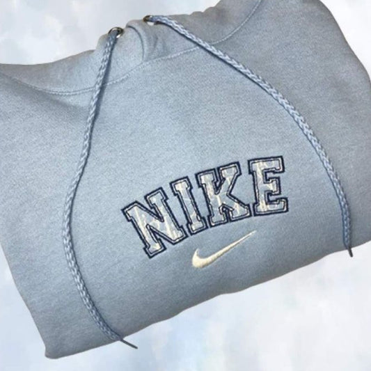 The Dior x Nike embroidered hoodie in light blue.