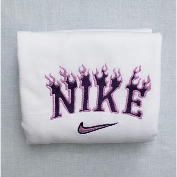 The Flames Nike embroidered crewneck in white with dark and light purple embroidery.