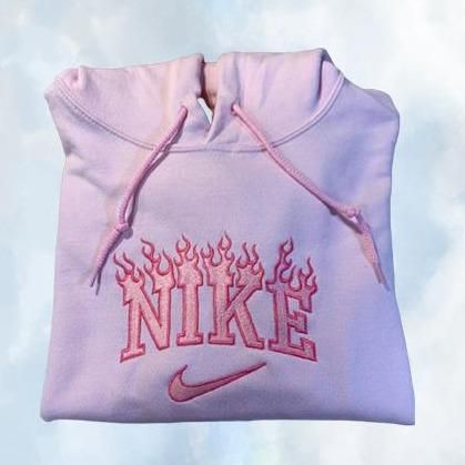 The Nike Flames embroidered unisex hoodie in light pink with hot pink embroidery.