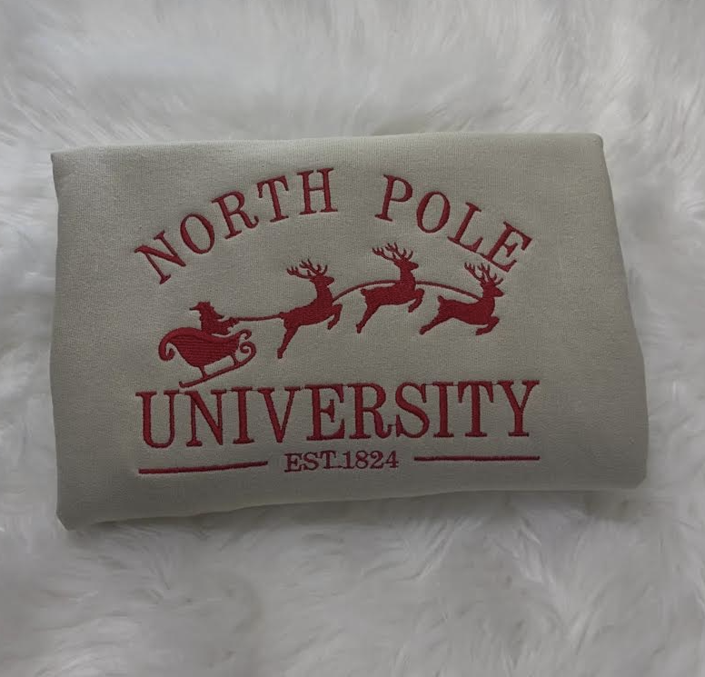 christmas theme north pole university embroidered sweatshirt in beige