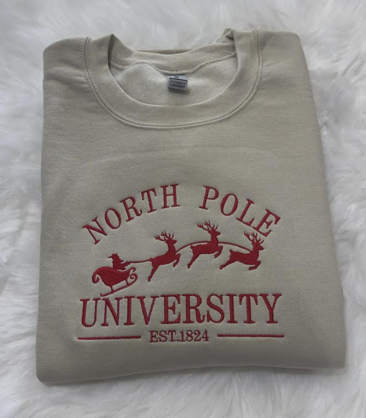 christmas theme north pole university embroidered sweatshirt in beige