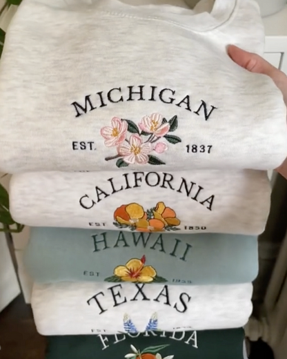 america states flower embroidered sweatshirts for michigan, california, and hawaii