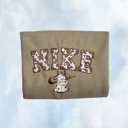 The vintage Nike cow embroidered crewneck in dark brown with brown embroidery.