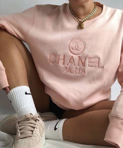 The vintage Chanel embroidered sweatshirt in light pink.