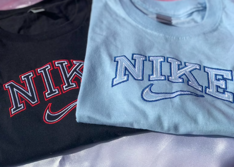 The vintage nike t-shirts in light blue and black.